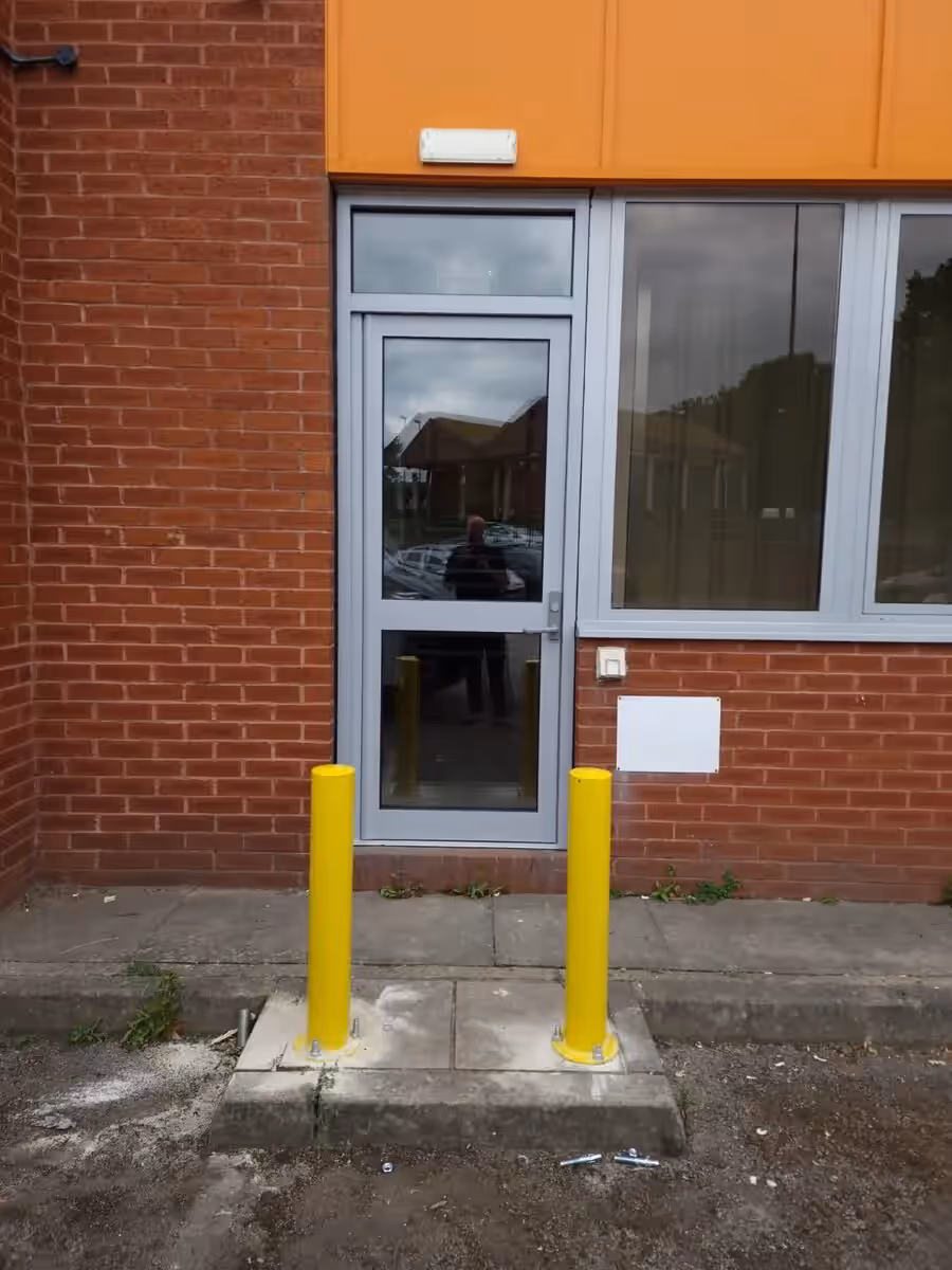 Commercial aluminium shopfront entrance illustrating a city-centre installation requirement