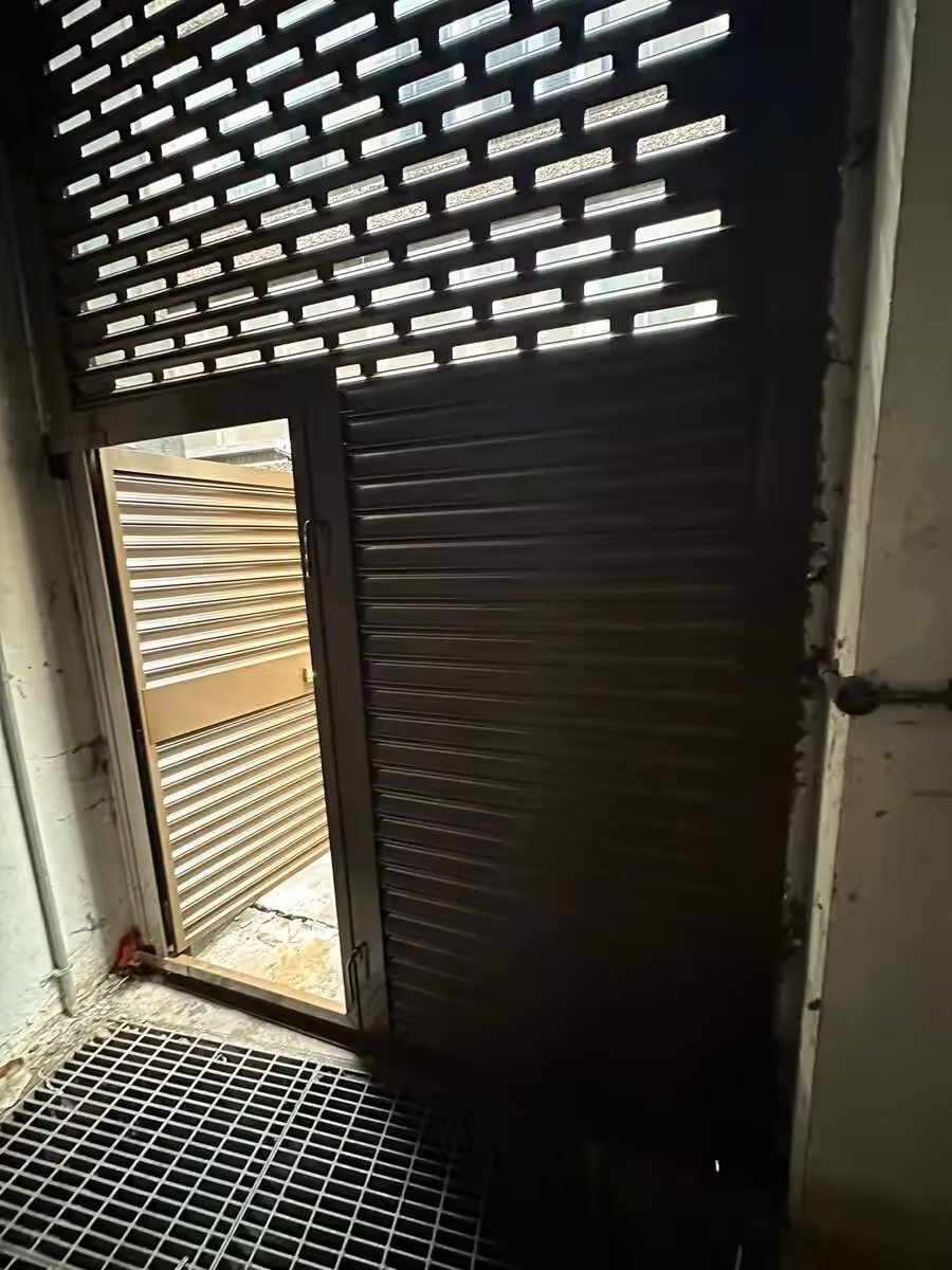 Open security roller shutter installed by Avanti Doors